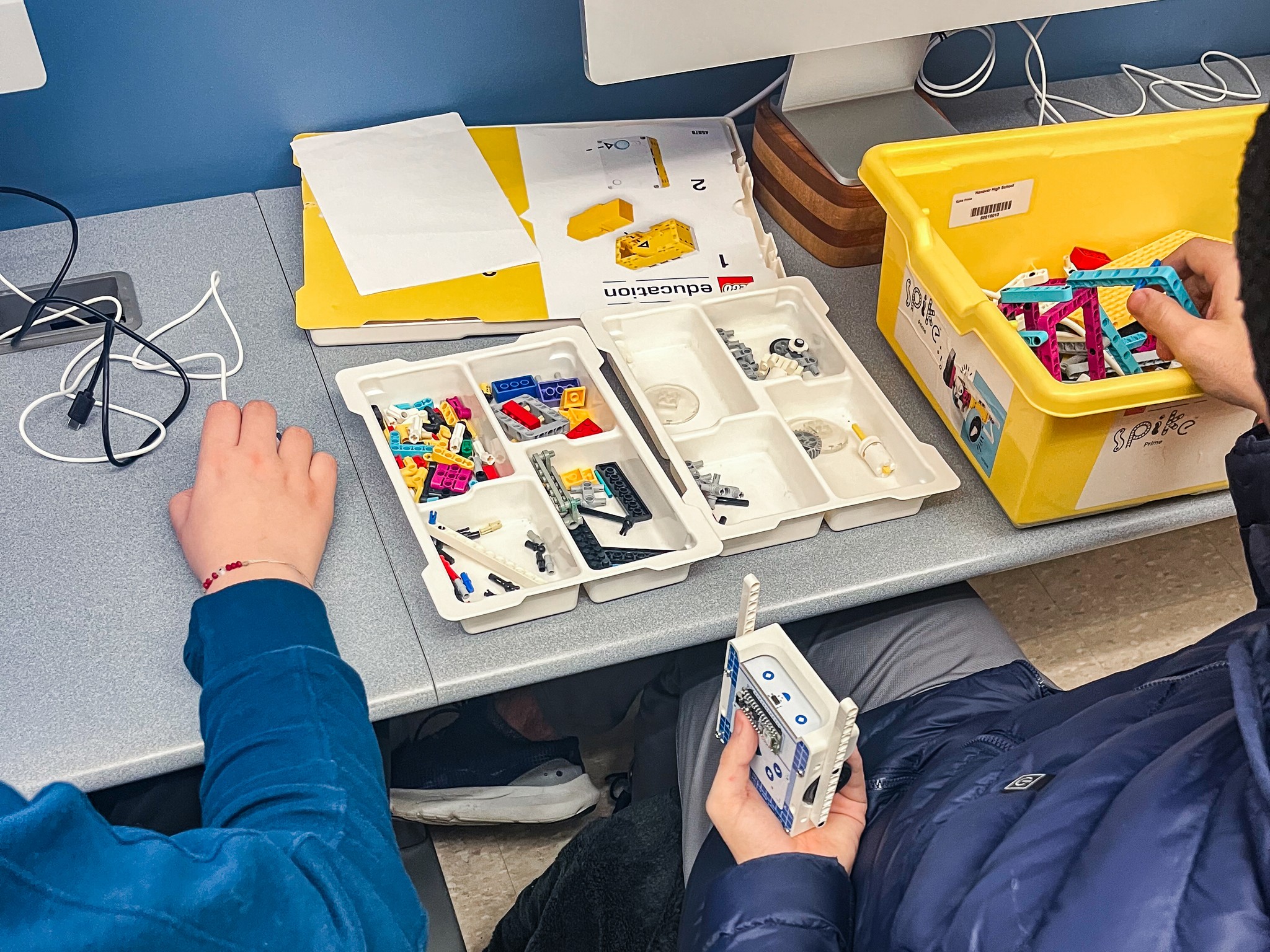 Close-up of a high school student using the Arduino Alvik robot car with lego during usability testing session – Liam Aljundi