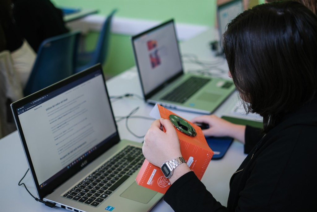 Close-up of a student using the Arduino Explore IoT Kit and keyboards on a desk during usability testing session – Liam Aljundi